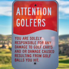 Wall Mural - Square frame Attention Golfers sign at a golf course with blurry mountain and sky background