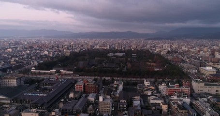 Wall Mural - Aerial flying from Nijo park and castle in Kyoto city at sunrise.