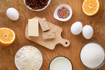 Wall Mural - Ingredients for making easter cake on a wooden table