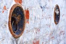 Rusty Metallic Mooring Ring On Wall