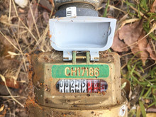 Top-down View Of A Local Council Water Meter With Cover Open To Reveal Measuring , , Gauge