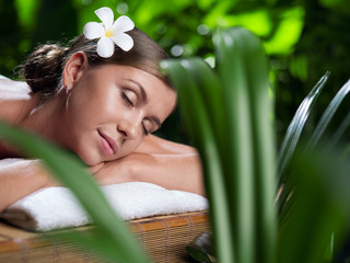 portrait of young beautiful woman in spa environment.  