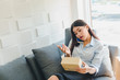 © Nawarit - Asian woman startup small business about sme. The girl accepts the order online. By internet and telephone. SME is an independent business concept.