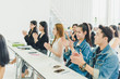© Nawarit - Asians attend seminars and listen to lectures from speakers in the training room. Some people raised their hands to ask the narrator. And applauded when the speaker finished speaking.