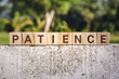 Wooden Block With The Word Patience