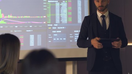 Wall Mural - The businessman standing near the large screen