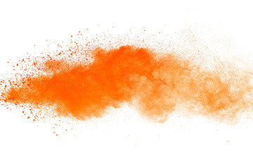 Wall Mural - abstract orange powder explosion. closeup of orange dust particle splash isolated on white backgroun
