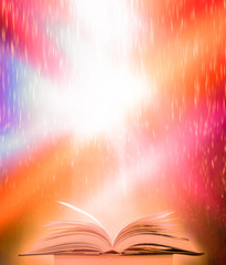Poster - The blurred book that is bewitched with magic, the magic light in the dark, with the bright light shining down as the power to search for knowledge. For research and use as a blurred background