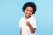 © khosrork - Hey you! Portrait of cheerful funny little boy with curly hair pointing finger to camera and smiling, child making choice indicating at you, showing direction. studio shot isolated on blue background