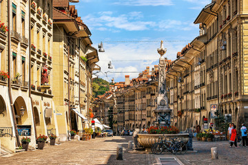 Sticker - Bern, Switzerland - August 31, 2016: People at Kreuzgassbrunnen in Kramgasse street with shopping area in old city center of Bern, Switzerland