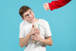 a bully's fist in a red sweatshirt threatens a nerd with glasses with a book