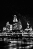 Fototapeta  - Night shot of the illuminated skyscrapers of the City of London in black and white, London, United Kingdom