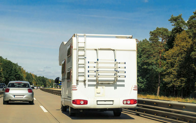 Sticker - Caravan and car on the road in Switzerland.