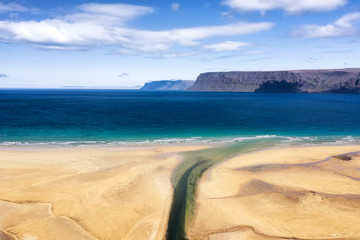 Iceland. Aerial view on the coast line, mountains and ocean. Beach and sea from air. Famous place in Iceland. Summer seascape from drone. Travel - image