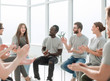 © ASDF - cheerful workshop participants applauding together for their speaker