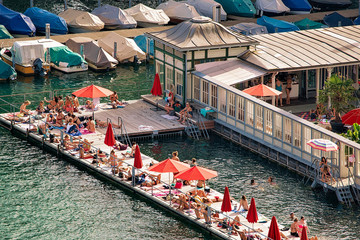 Wall Mural - Women beach at Limmat River quay in the city center of Zurich, Switzerland