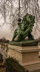 Statue of the lion and child in Retiro Park, Madrid Travel concept.