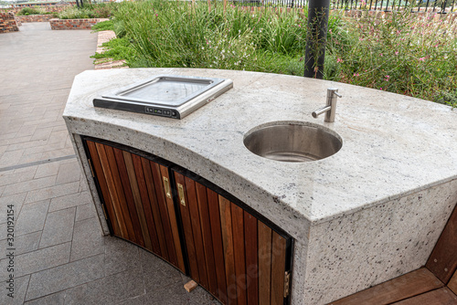 outdoor bbq and sink on top of apartment block