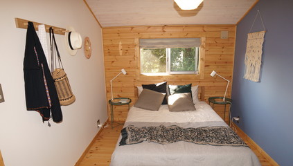 Modern bedroom in wood house