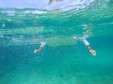 Fototapeta Łazienka - Surfing on the ocean wave photo underwater