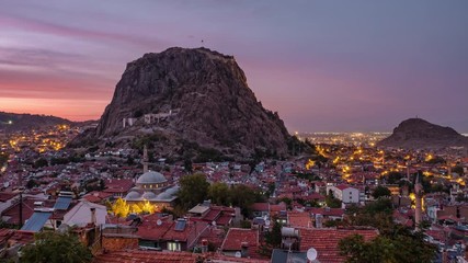 Wall Mural - 4K Sunset Time lapse of the Afyon city cityscape with Afyon castle on the rock