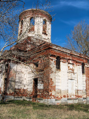 Wall Mural - Abandoned old brick church on a sunny day in Russia