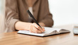 © Prostock-studio - Cropped image of manager taking notes with pen