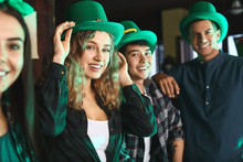 Young Friends Celebrating St. Patrick's Day In Pub