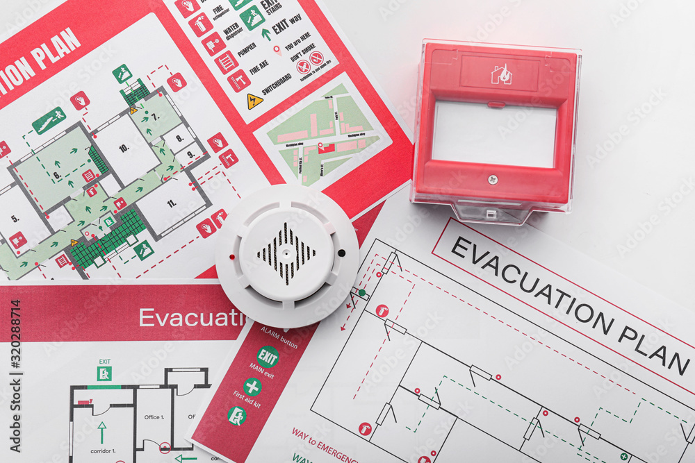 Evacuation plans, smoke detector and manual call point on white background - obrazy, fototapety, plakaty 