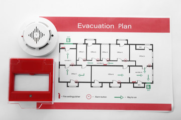 Wall Mural - Evacuation plan, smoke detector and manual call point on white background