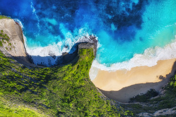 Wall Mural - aerial view at sea and rocks. turquoise water background from top view. summer seascape from air. su