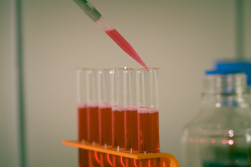 Sticker - Test tube in rack and pipette media dispenser.