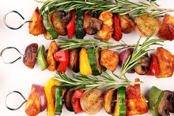 Wall Mural - Grilled pork shish or kebab on skewers with vegetables . Food background shashlik