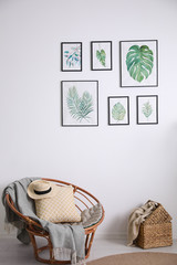 Wall Mural - Beautiful paintings of tropical leaves on white wall in living room interior