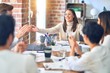 © Krakenimages.com - Group of business workers smiling happy and confident. Working together with smile on face applauding one of them at the office