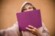 Elderly female posing with sketchbook stock photo