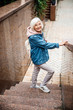 © Yakobchuk Olena - Smiling seniour woman at stairs outdoors stock photo
