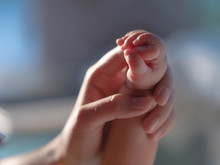 Newborn Baby Is Holding The Mother's Hand