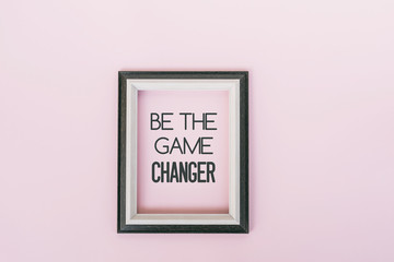 Wall Mural - Motivational and inspirational quotes - Be the game changer. Pink backgrounds