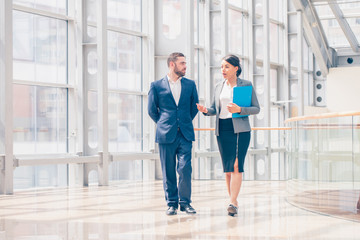 business people walk together