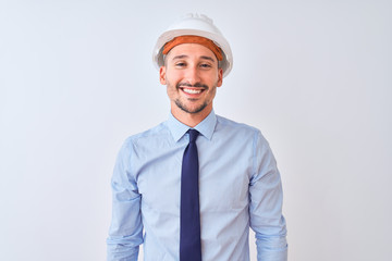 Sticker - Young business man wearing contractor safety helmet over isolated background with a happy and cool smile on face. Lucky person.