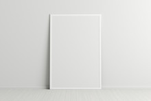 Blank Vertical Poster Frame Mock Up Standing On White Floor Next To White Wall. Clipping Path Around Poster. 3d Illustration