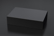 Blank black wide flat box with closed hinged flap lid on black background. Clipping path around box mock up. 3d illustration
