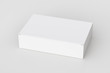 Blank white wide flat box with closed hinged flap lid on white background. Clipping path around box mock up. 3d illustration