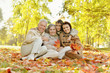 © aletia2011 - Portrait of happy family relaxing in autumn forest