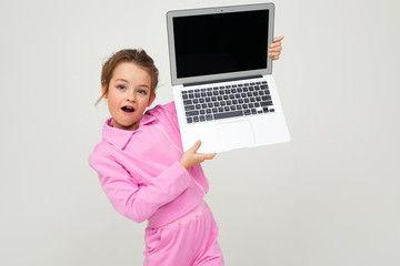 contented caucasian girl holding a laptop with the screen forward with the layout for the page on a white background