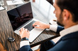 © Yakobchuk Olena - Focused modern office worker using his computer