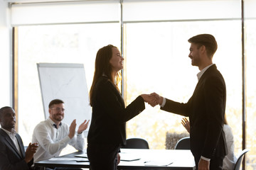 Wall Mural - boss thanking woman business coach after seminar