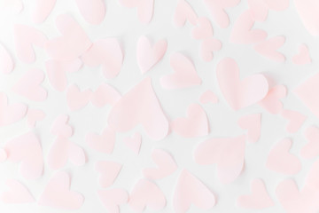 Cute pink pastel hearts on white paper  background. Flat lay. Happy valentines day. Pink paper heart cutouts on white backdrop, gentle image, greeting card. Valentine pattern