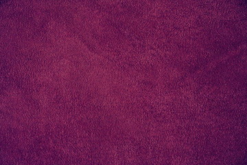 Wall Mural - The texture of natural suede. Purple background of leather material.